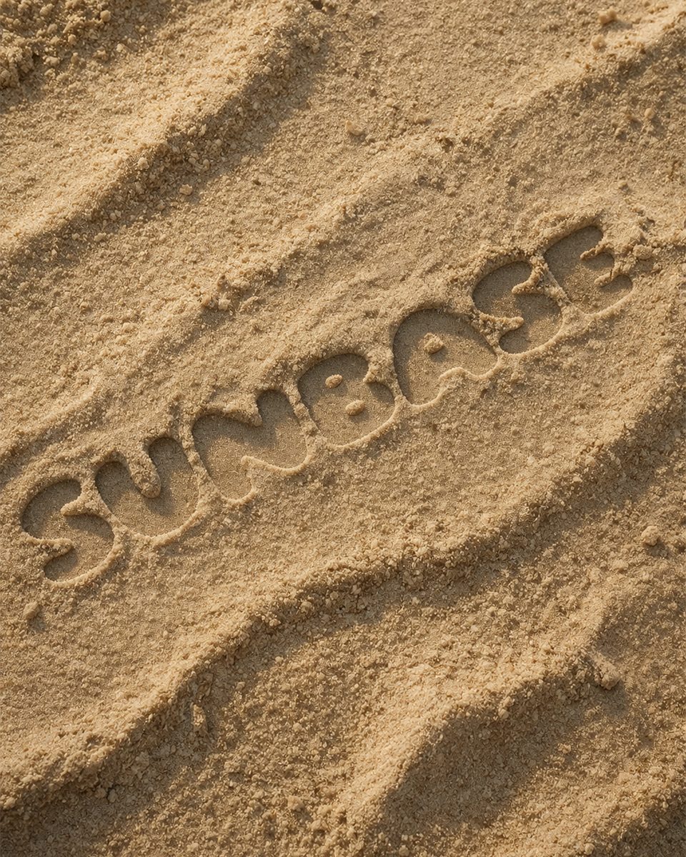 SUNBASE — naam in zand